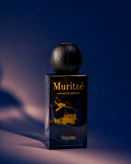 A bottle of Muritzé extrait de parfum by Siyate, featuring a dark, textured spherical cap and a rectangular glass base with gold lettering and a gold illustration, set against a dark blue background with dramatic lighting.