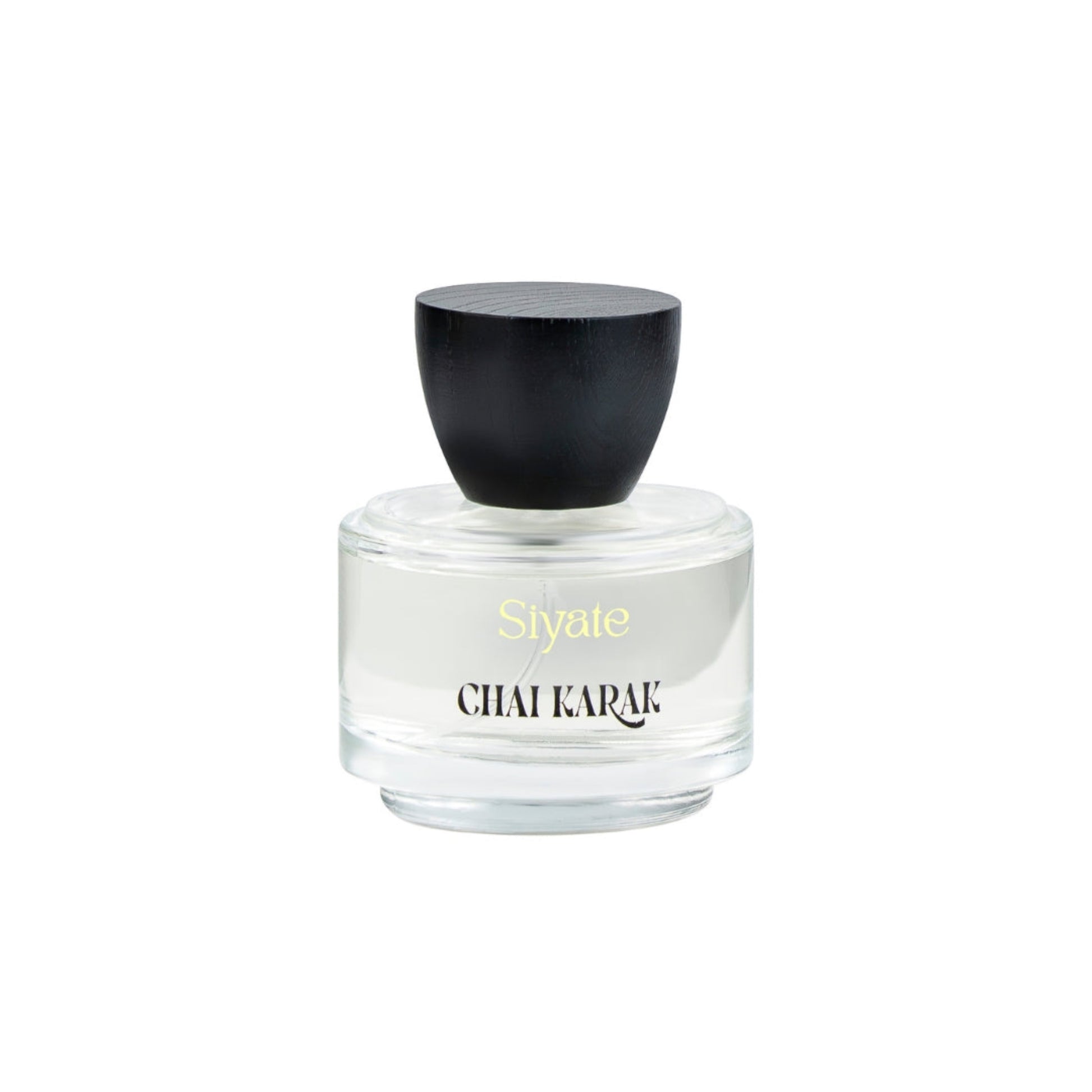 Perfume bottle with black cap and white body on a white background